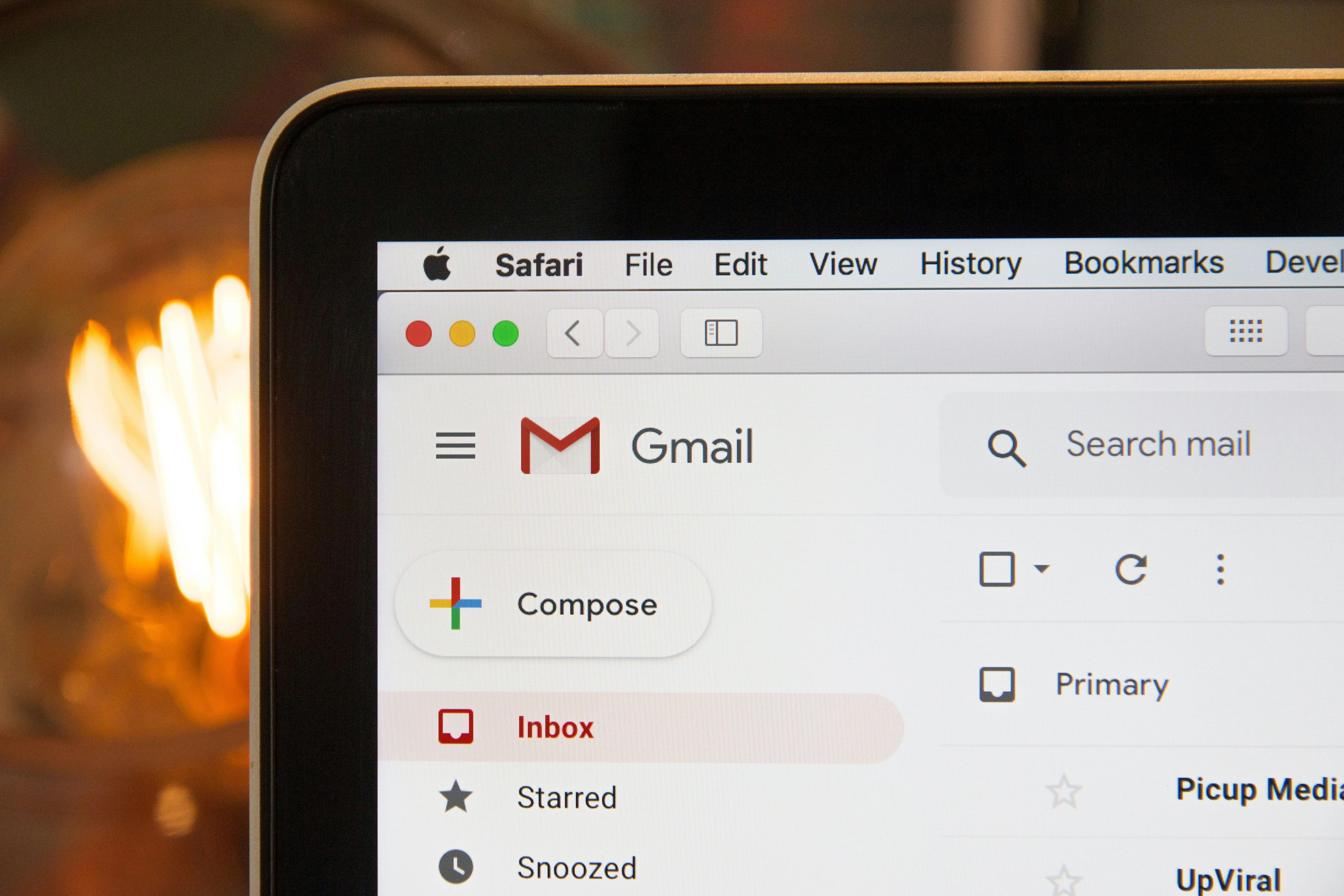 An image of Gmail's dashboard being displayed on a laptop